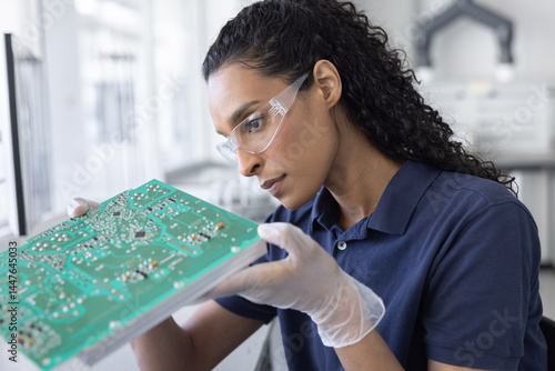 Technician Analyzing Circuit Board Components
