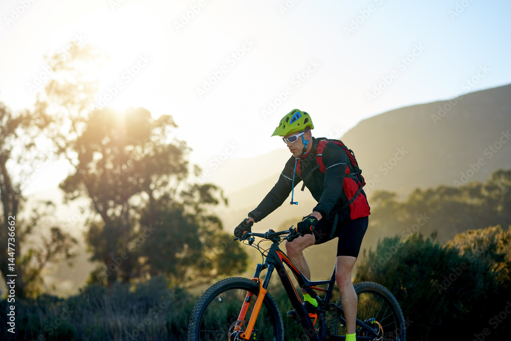 Fototapeta premium Mountain bike, off road and sports with man outdoor for adrenaline, adventure or cardio training. Exercise, fitness and hobby with person cycling in nature for challenge, competition or performance