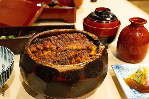 Unagi don grilled eel over rice in a wooden bowl