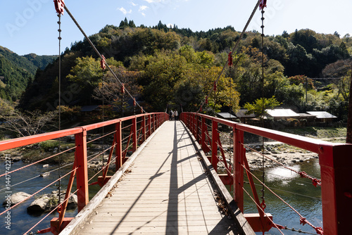 Koran bridge across Tomoe river at Korankei gorge during autumn season