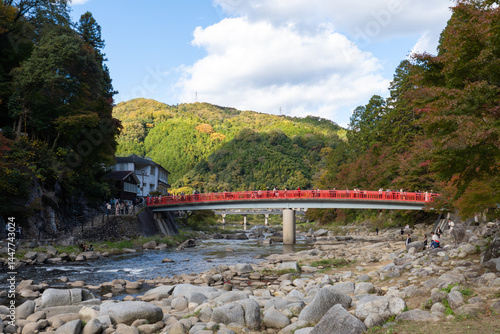 Taigetsu bridge across Tomoe river at Korankei gorge during autumn season