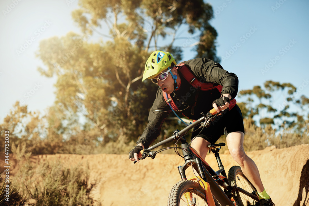 Naklejka premium Bike, speed and sports with man in mountains for outdoor adrenaline, adventure or training. Exercise, fitness and trail riding with person cycling off road for challenge, competition or performance