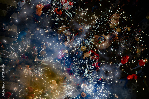 Fotografija Aerial view of the correfoc, a traditional catalan celebration with fireworks an
