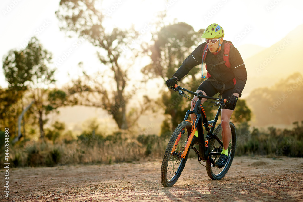 Man, cycling or mountain with bike for fitness, extreme sport or outdoor exercise in nature. Active, male person or cyclist riding with bicycle or helmet for adrenaline or cardio workout on dirt road Man, cycling or mountain with bike for fitness, extreme sport or outdoor exercise in nature. Active, male person or cyclist riding with bicycle or helmet for adrenaline or cardio workout on dirt road