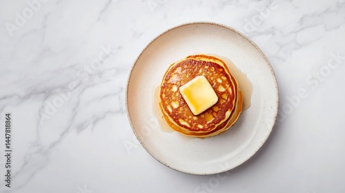 Stack of fluffy American pancake topped butter maple syrup white plate top down view white background Classic USA breakfast clean minimal style food stock image cut out isolated transparent background