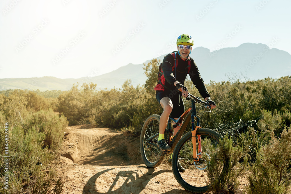 Naklejka premium Bike, smile and sports with man on mountain trail for adrenaline, adventure or training. Exercise, excitement and fitness with happy person cycling in nature for challenge, competition or performance