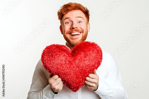 Obraz na płótnie Isolated white adult man on pure white background with fluffy heart in hands. Professional studio pic, copy space. Cute Valentine's Day greeting. w salonie