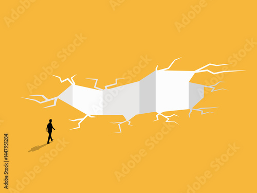 Businessman walking towards the big trap hole