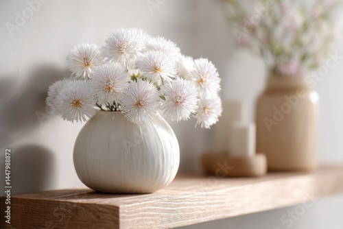 Obraz na płótnie Display of White Flowers in a Modern Vase on a Wooden Shelf w salonie