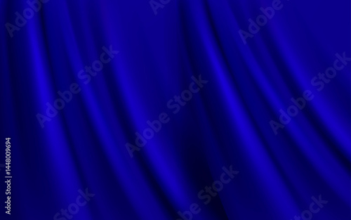 flowing blue fabric with soft folds and highlights. The way the light interacts with the material suggests a silky or satin-like texture, creating a sense of elegance and movement.