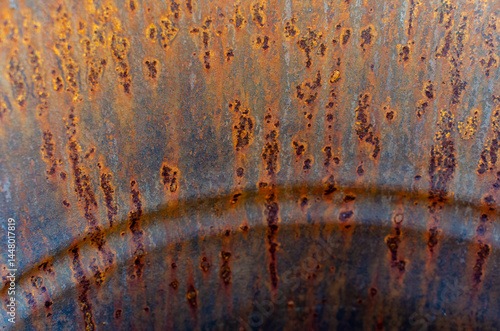 Rust forming inside a metal water barrel, causing corrosion and gradual damage to the barrel walls. Close-up view of oxidation, metal deterioration, and the need for rust protection and maintenance.