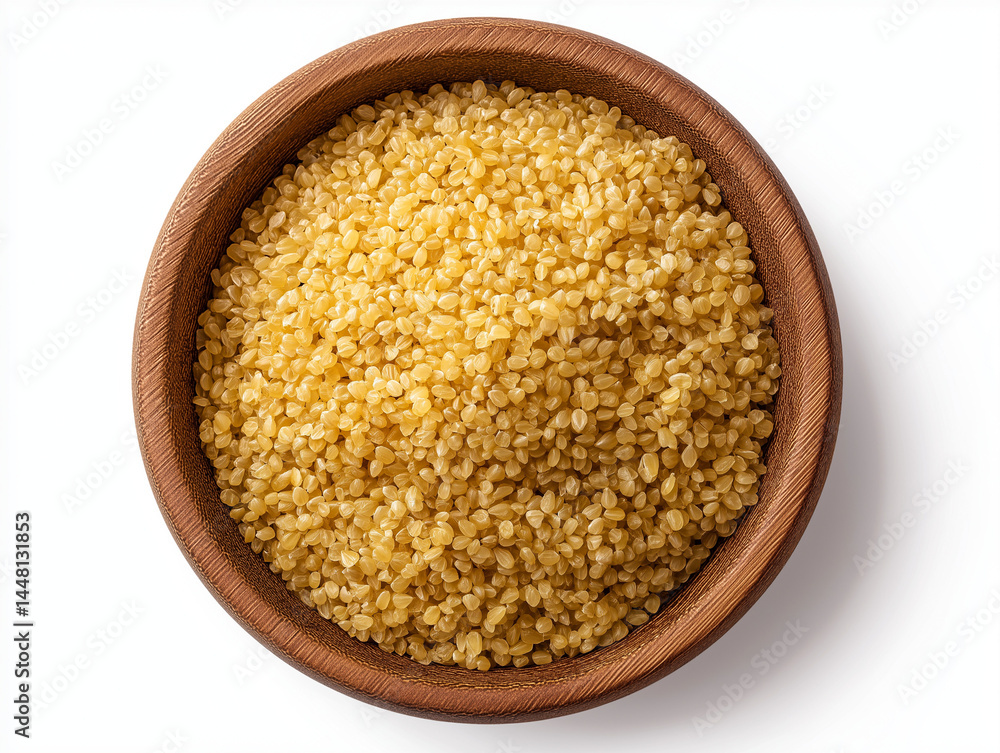 Bulgur wheat in a wooden bowl, top view isolated on white with clipping path. Bulgur wheat in a wooden bowl, top view isolated on white with clipping path.