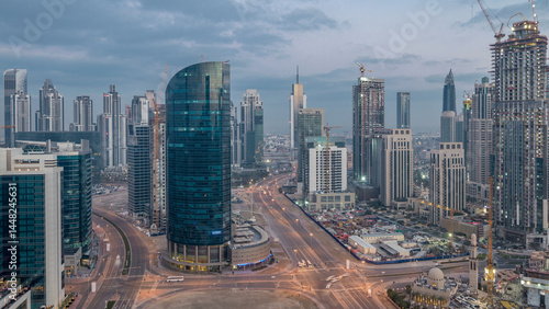 Wallpaper Mural Dubai Downtown night to day timelapse. Aerial view over big futuristic city by night. Torontodigital.ca