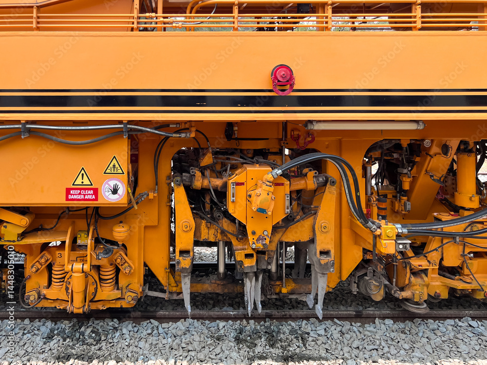 Ballast tamper machine at Railway Station.