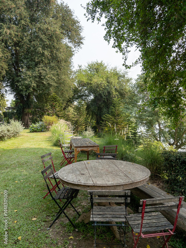 Obraz na płótnie Inviting Garden Table and Chairs for Relaxation. w salonie
