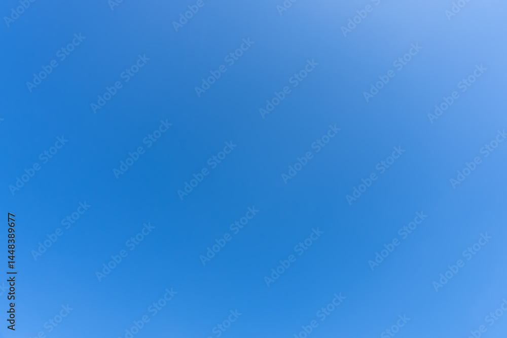 Beautiful light blue sky without clouds in the morning or afternoon on sunny day used as natural background texture in decorative art work Beautiful light blue sky without clouds in the morning or afternoon on sunny day used as natural background texture in decorative art work