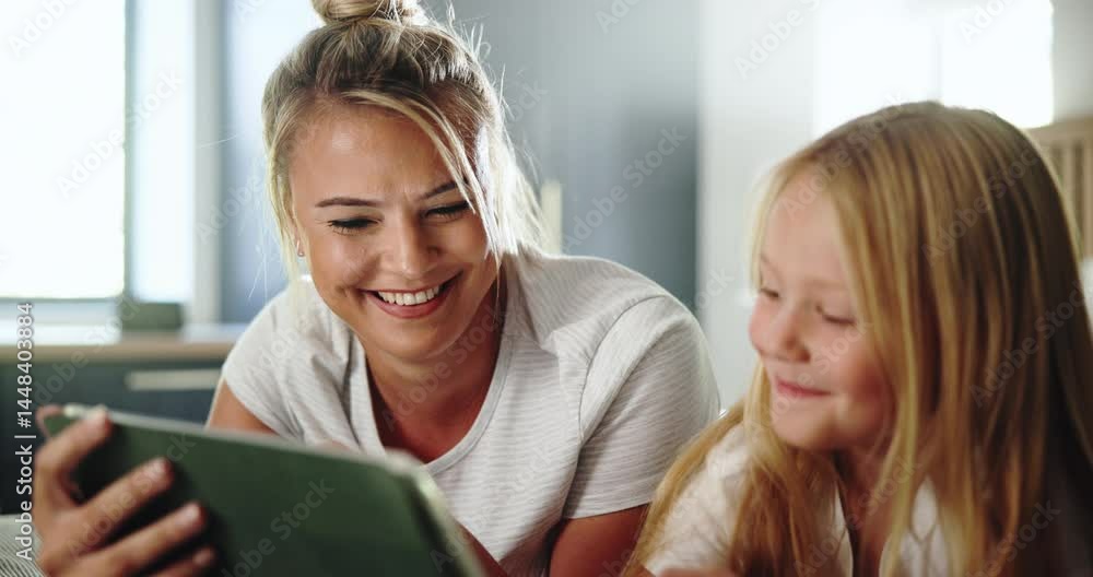 Bedroom, mother and child with smile for tablet, streaming service and check for cartoon to watch. Home, mom and girl with digital for movie website, connection and bonding together with happiness Bedroom, mother and child with smile for tablet, streaming service and check for cartoon to watch. Home, mom and girl with digital for movie website, connection and bonding together with happiness