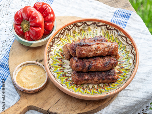 pickled peppers with meat rolls mititei and mustard traditional romanian food