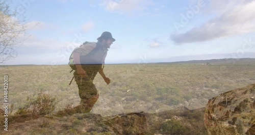 hiker leaping onto rocky outcrop under sky, displaying animated growth chart for outdoor marketing