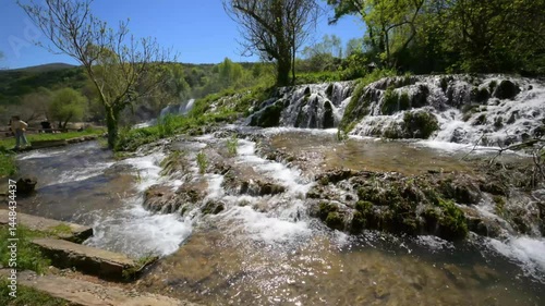 Kravica Waterfall in Bosnia and Herzegovina on a Sunny Day with beautiful emerald water and lush greenery