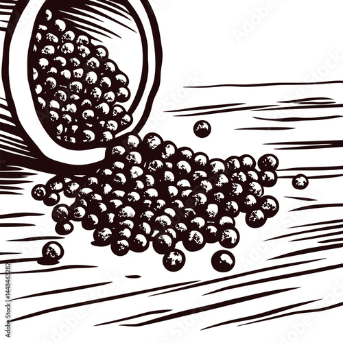 Black peppercorns spilling from overturned container onto wooden surface in rustic kitchen setting.