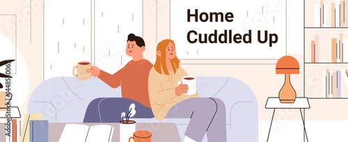 Couple relaxing cozy living room drinking coffee sofa modern home interior bookshelf lamp warm colors