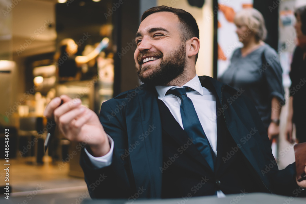Cheerful entrepreneur with notebook smiling in cafe