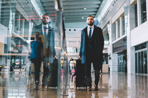 Elegant traveler walking on airport corridor