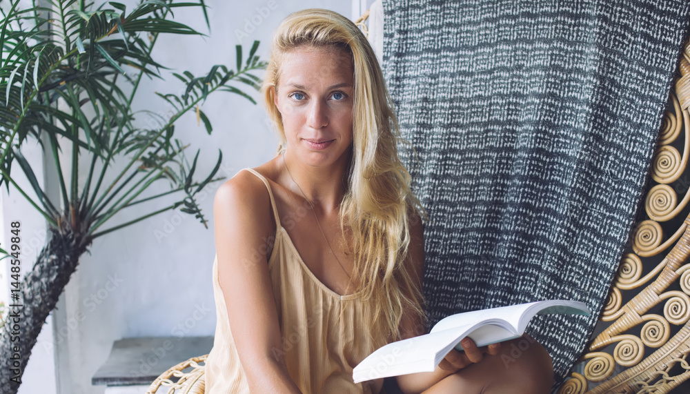 Young woman holding open book
