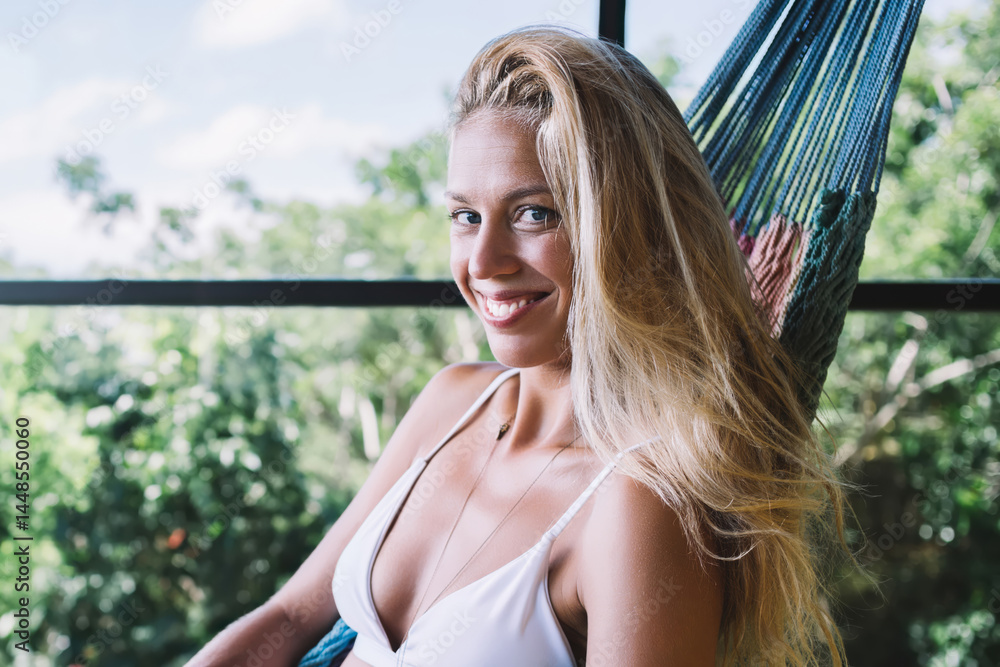 Cheerful woman browsing laptop and having rest