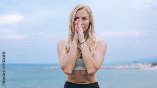 Obraz na płótnie Slim woman sitting in lotus pose near seafront w salonie