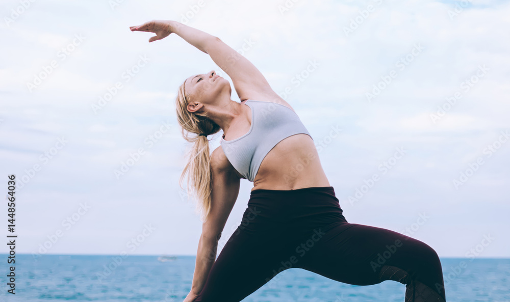 Young woman stretching in yoga pose