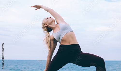 Obraz na płótnie Young woman stretching in yoga pose w salonie