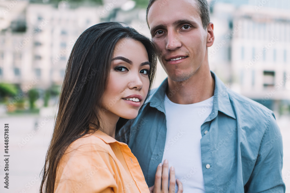 Multiracial couple standing on city square