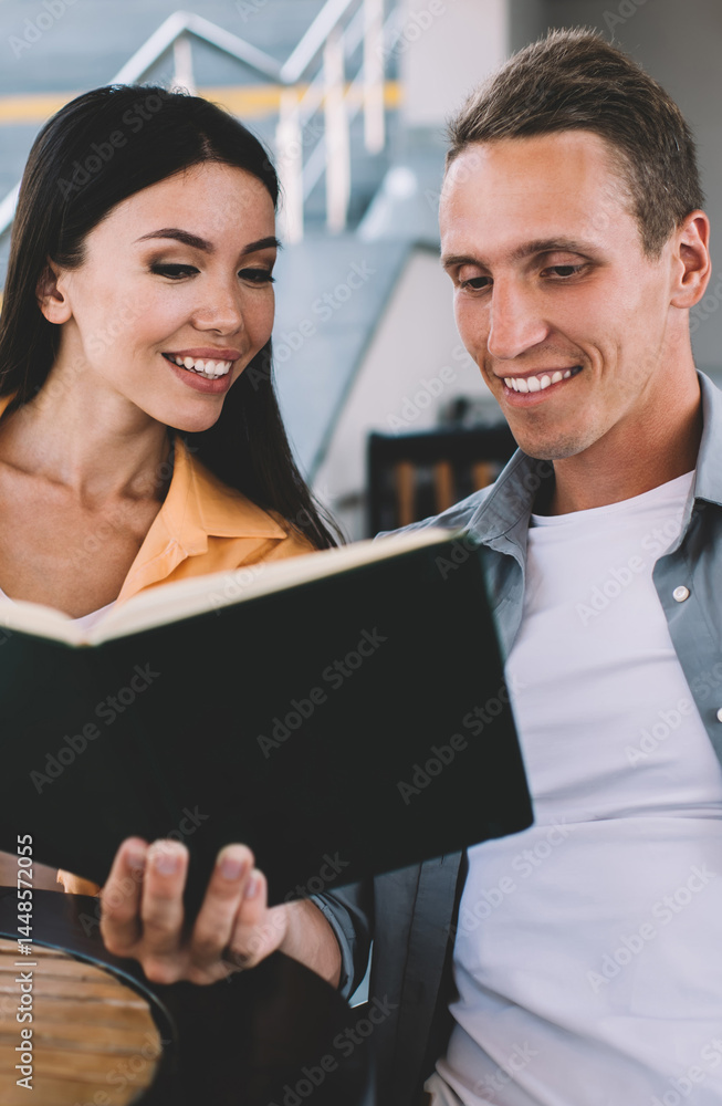 Businessman sharing ideas with female colleague