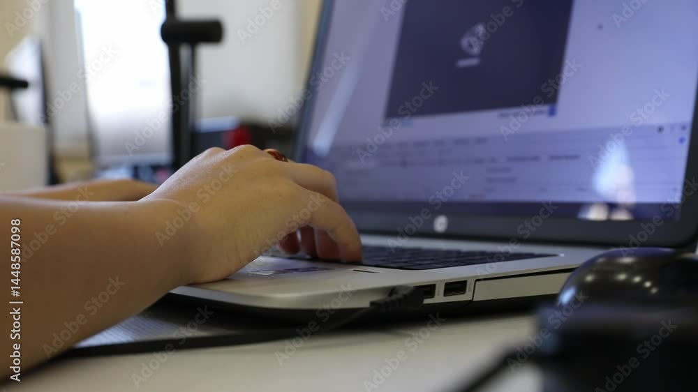 Focus on the hands of two people using laptops in a modern office. Shows collaboration, technology, and efficient workspace dynamics. Good for business and technology concepts. Focus on the hands of two people using laptops in a modern office. Shows collaboration, technology, and efficient workspace dynamics. Good for business and technology concepts.