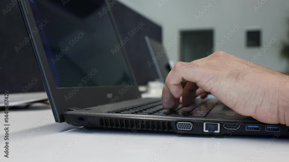 Focus on the hands of two people using laptops in a modern office. Shows collaboration, technology, and efficient workspace dynamics. Good for business and technology concepts. Focus on the hands of two people using laptops in a modern office. Shows collaboration, technology, and efficient workspace dynamics. Good for business and technology concepts.