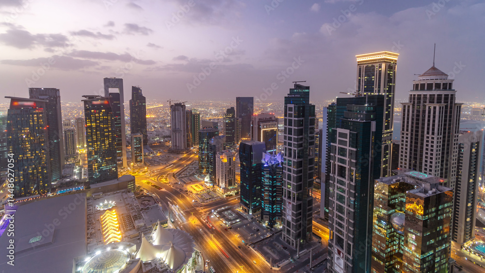 Fototapeta premium The skyline of the West Bay area from top in Doha day to night timelapse, Qatar.