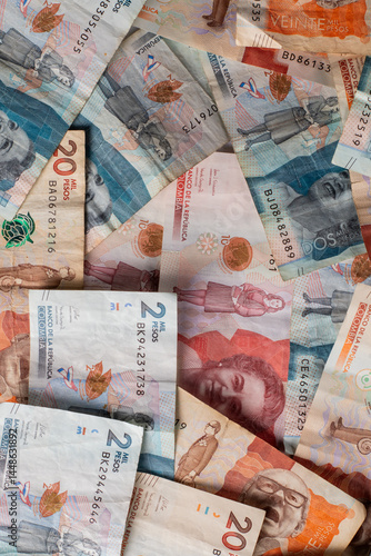 Pile of Mixed Colombian Bills Spread on a Table