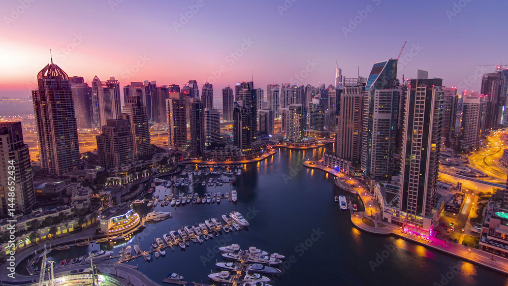 Obraz premium Dubai marina harbor panorama from night to day transition timelapse