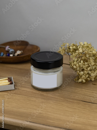 Burning Candle in the bathroom on a marble background, cozy atmosphere