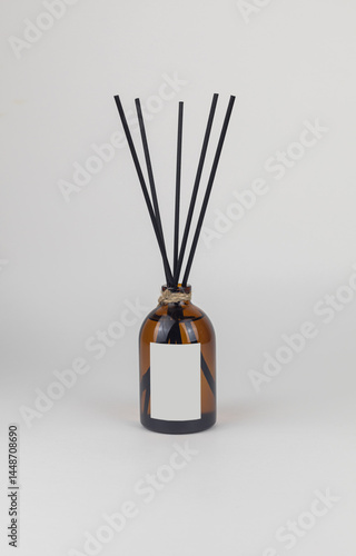 Aromatic diffuser bottle with sticks isolated on white background