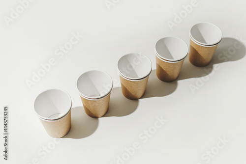 Many Recyclable Cardboard Disposable Cups on White.