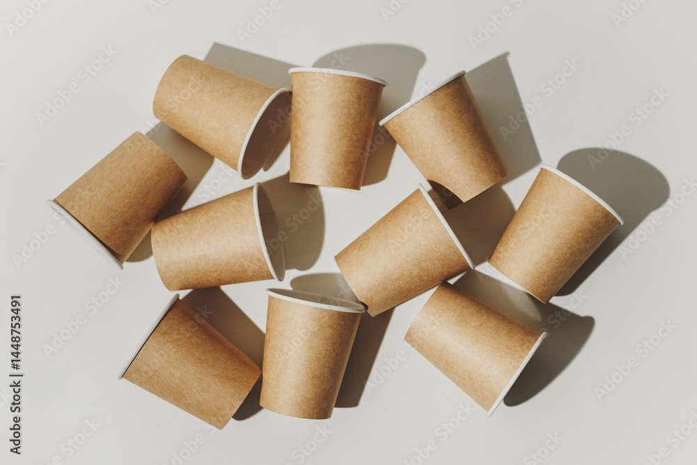 Many Recyclable Cardboard Disposable Cups on White.