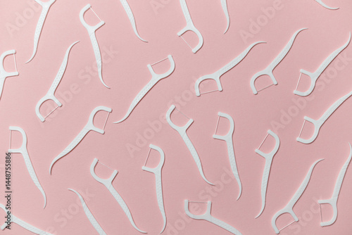 Obraz na płótnie Dental floss with handle on pink background, flat lay w salonie
