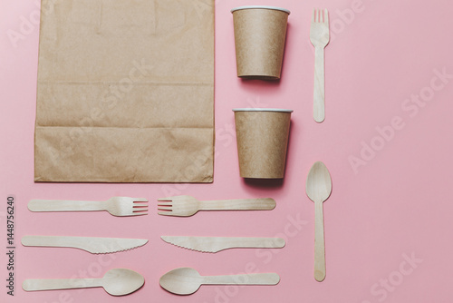 Obraz na płótnie Flat lay composition with eco friendly paper disposable tableware on pink background. w salonie