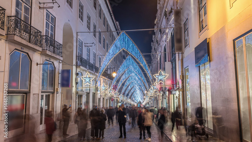 Night timelapse hyperlapse of Christmas lights and decorations in downtown Lisbon at Chiado