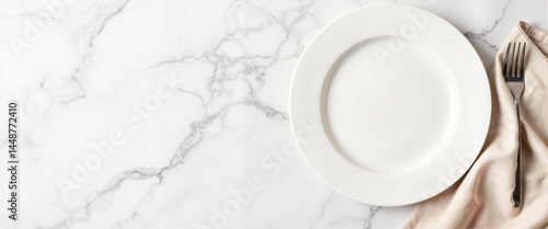 Empty white plate on marble backdrop with linen napkin, elegant dining concept