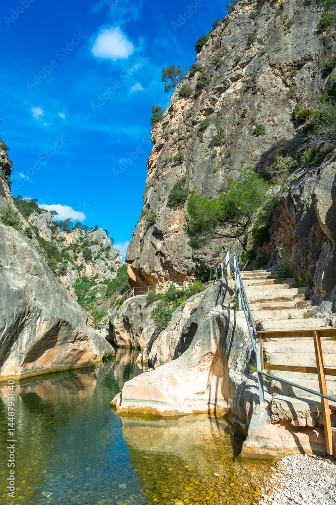 Hiking trail following canal de fontcalda in catalonia, spain