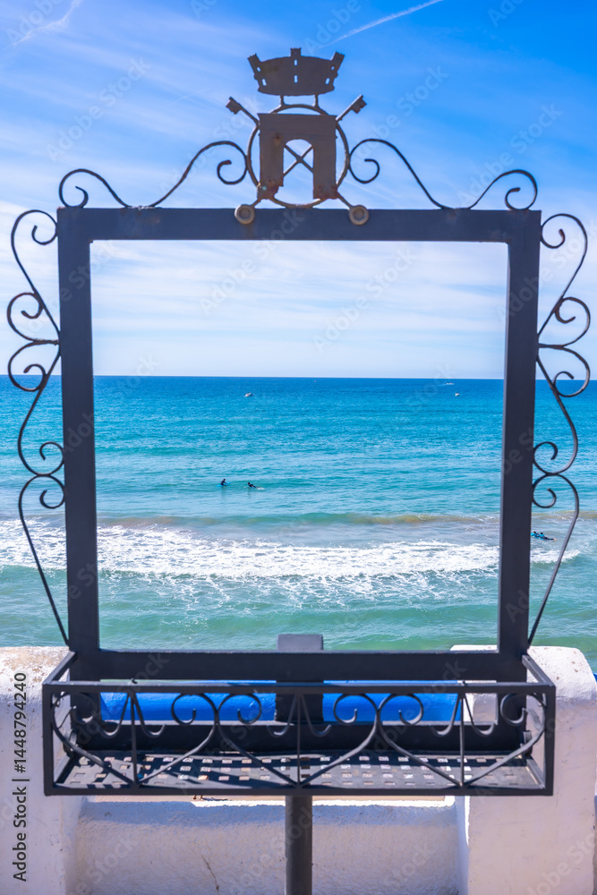 Decorative frame showcasing the mediterranean sea and roc de sant gaieta near comarruga